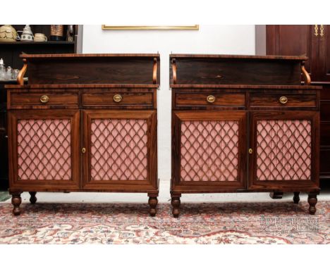 A pair of antique Regency style rosewood chiffoniers, the upper tier with pierced brass dentil frieze supported by scrolled p