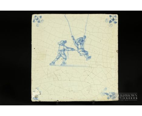 A 17th/18th century Delft blue & white pottery tile, of a man pushing another man on a swing 