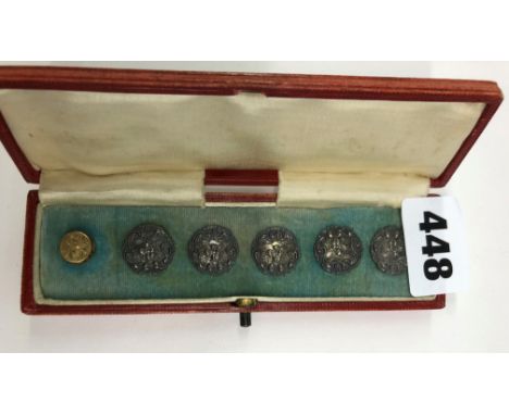 A CASE OF FIVE SILVER BUTTON (ONE MISSING)