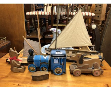 TWO MODEL BOATS, A DOG PULL ALONG TOY, TWO ENAMEL TINS