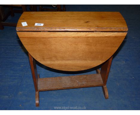 A small twist top drop leaf table.