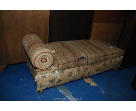 An upholstered daybed for restoration.