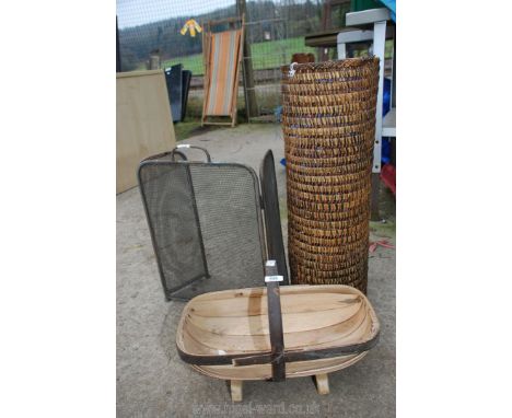 A vegetable trug, brass fire screen and a cane stick stand.