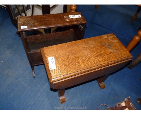 A small drop leaf side table and a wooden magazine rack.