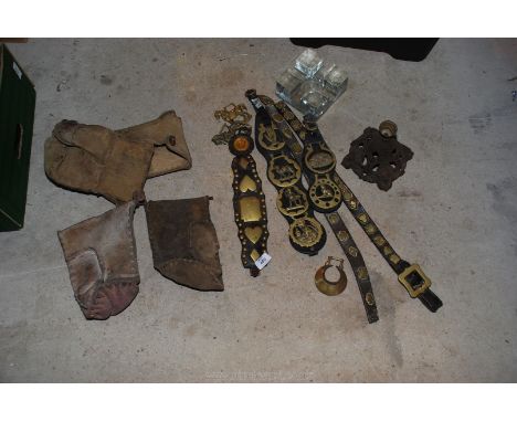 A quantity of horse brasses, oil lamp base and two pairs of hedging gloves.