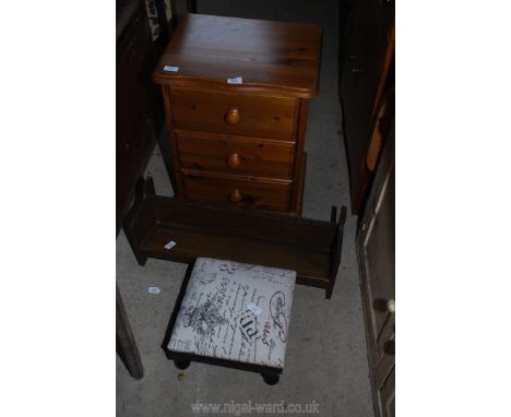 A folding gout stool, pine bedside table and a book trough.