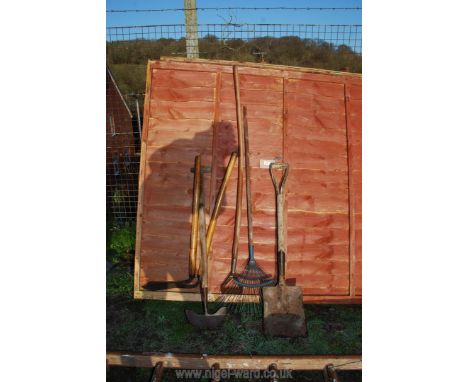A quantity of garden tools including a rake, a shovel, edgers, hoe, etc.,