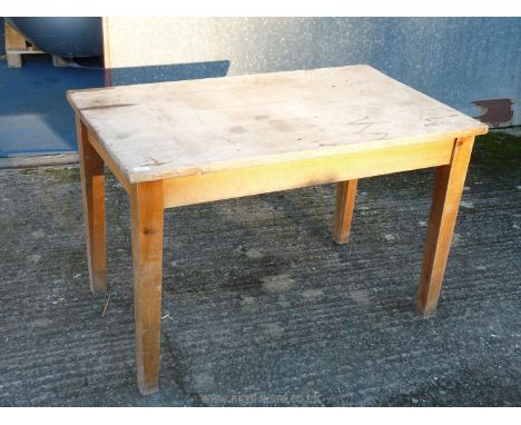 A pine kitchen table on square tapered legs, 27" x 45" x 29".