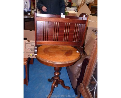 A round pedestal occasional table with magazine rack, 22" tall.