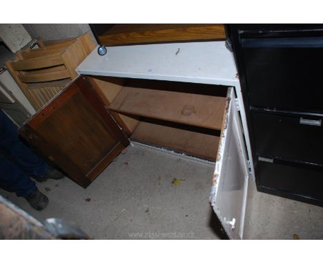 A painted wooden cupboard with shelf.