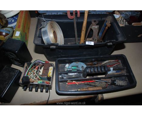 A tool box with various hand tools, a coil of aluminium tape, speakers, etc.,