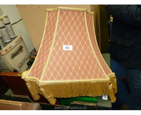 A terracotta and gold lamp shade.