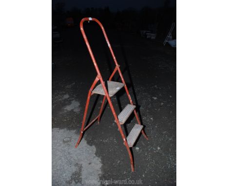 A three rung step ladder.