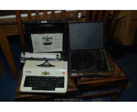 An Olympia portable typewriter and a mini electrical turntable.