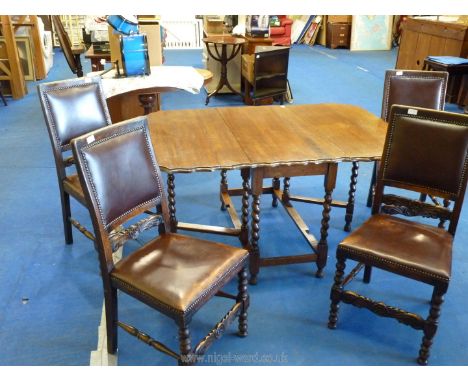 An oak piecrust extending gateleg table with barley twist legs plus four studded dining chairs with carved flower detail, 57"