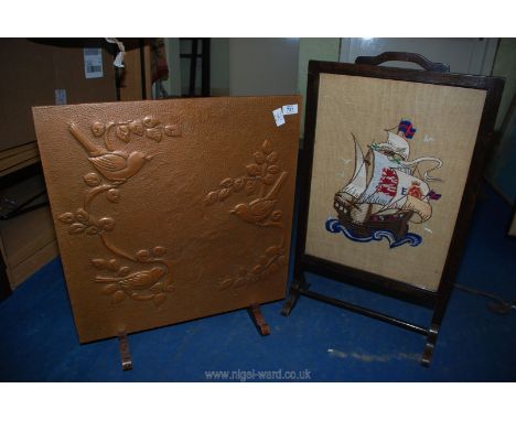 An Art Deco copper fire screen plus an embroidered fire screen.