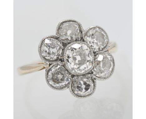 A diamond cluster ring set in yellow gold indistinctly hallmarked, size M