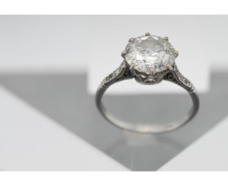 A large diamond ring set, with six smaller diamonds to the shoulders, size L/M, hallmarked rubbed. The main stone approx. 3.7