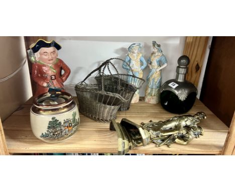 A pair of brass Britain's Pride door stops depicting sailors, two wine carafes, a Pirate toby jug, pair of bisque figures, pe