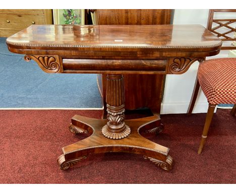 A late Regency mahogany fold over card table on pedestal platform base, top cross banded with a gadrooned edge, width 90cm
