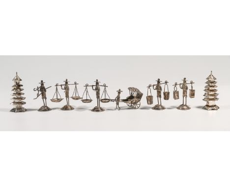 A Chinese silver cruet set comprising; six miniature of ‘farmer’ figures, three balancing a differing weighing or measuring i