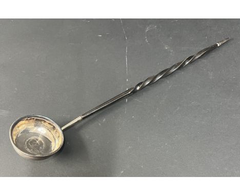 A silver punch ladle, with George IV 1724 coin in the base on whale bone handle.