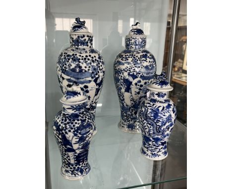 A pair of 19th/20th century Chinese blue and white porcelain jars and covers each with four character apocryphal Kangxi marks