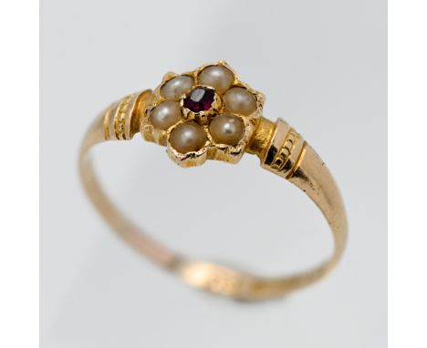 A 15ct gold ruby and seed pearl 'Flower' style ring, size J, approx. 1.5g.