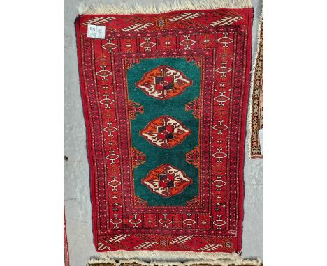 Three Oriental small rugs including a Tekke mat, a flat weave example and a tribal prayer rug (3)