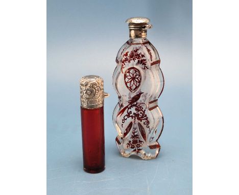A Birmingham silver mounted red glass cylindrical scent bottle together with a Bohemian ruby overlay scent bottle