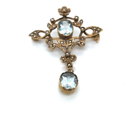 A vintage 9ct hallmarked gold aquamarine and seed pearl Art Nouveau style pendant brooch. Measurements 4.3 x 3.3 cms. Weight 