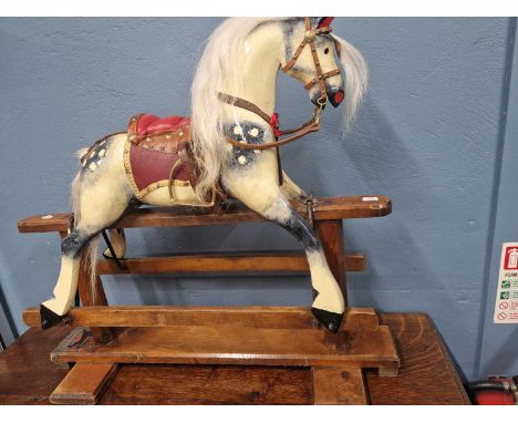 A small vintage childs rocking horse. 