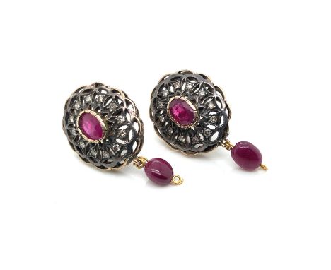 A pair of ruby and diamond cluster earrings with a cabochon ruby drop. Diameter 1.9 cm. Unhallmarked, assessed as 9ct gold an