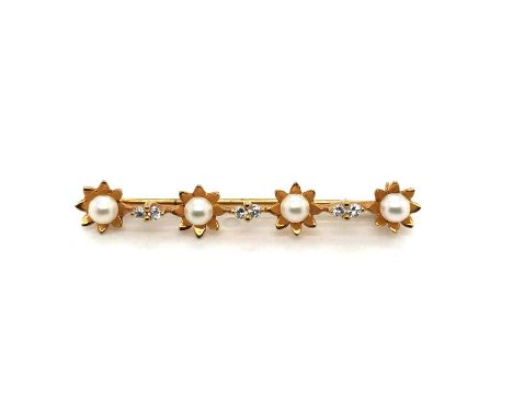 A 9ct hallmarked vintage cultured pearl and diamond bar brooch. The four cultured pearls are held in a floral head interspers