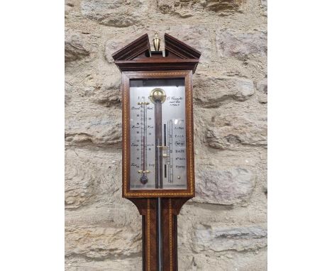 A Committi mahogany stick barometer with barber's pole line inlay, the silvered dial flanked by an alcohol thermometer