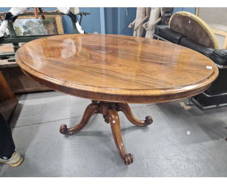 A rosewood Victorian oval tilt top table by Wilkinson London H 74 W 131 cm.