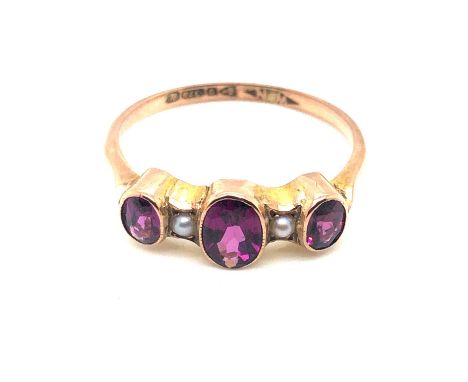 An antique 9ct hallmarked gold rhodolite and pearl ring. Dated 1920, Chester. Size S 1/2. Weight 2.4 grams. 