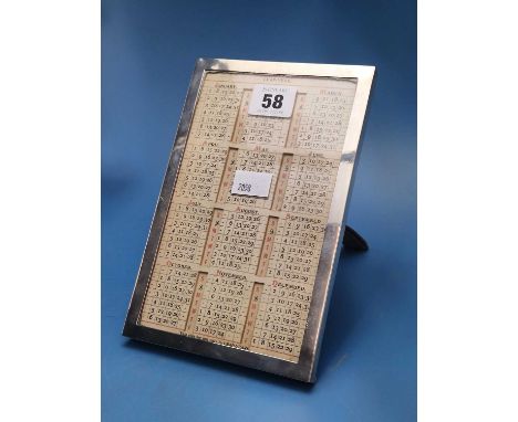 An easel backed silver framed perpetual calendar by J G Vickery, London 1910, the frame.   20 x 13cms