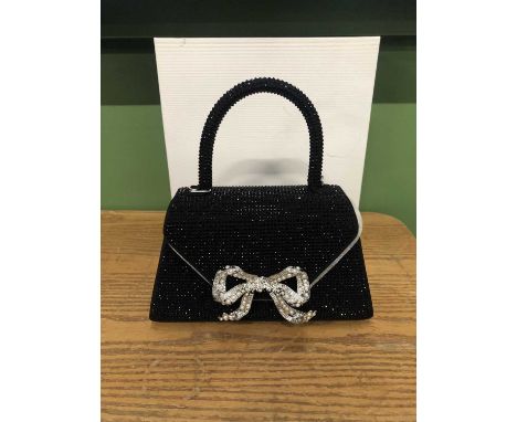 A small black Self-portrait rhinestone embellished bag with bow detail. 21cms along the base