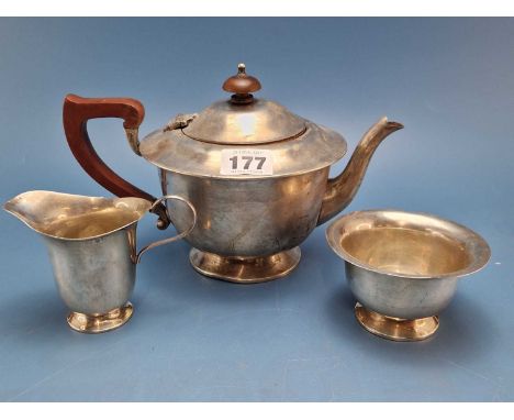 A silver three piece tea set by Adie Brothers, Birmingham 1947, the tea pot with a brown bakelite handle and cover knop, 492G