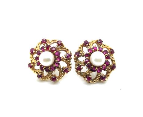 A pair of vintage ruby and cultured pearl large stud earrings. Diameter 1.8 cm. Unhallmarked, assessed as 9ct gold. Gross wei