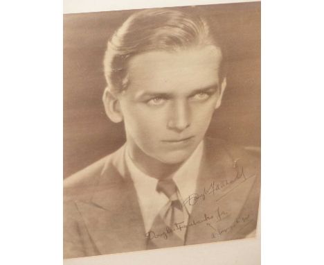Douglas Fairbanks. An ink signed &amp; inscribed portrait photograph. 26 x 24 cm.