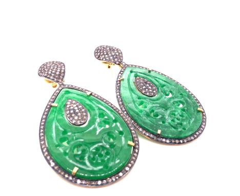 A pair of carved green jade and multi-diamond articulating drop earrings. Drop 6.3 cm widest point 3.1 cm. Unhallmarked, asse