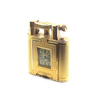 Alfred Dunhill. A rare 9ct Hallmarked gold Unique pocket lighter Featuring a rectangular watch timepiece to one side. Made in