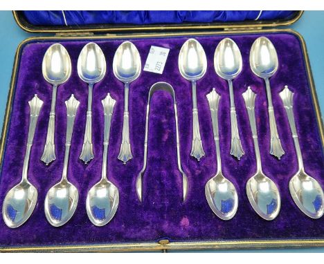 A cased set of twelve silver tea spoons with sugar tongs by Harrison Brothers and Howson, Sheffield 1909, 170Gms. 