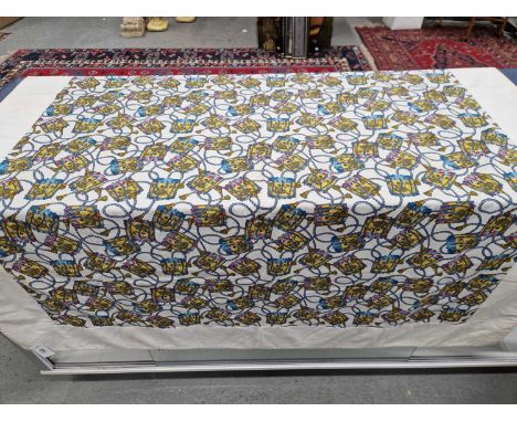 A Hermes cotton panel tablecloth printed with a pattern of regimental drums tied with tasselled blue cords against a white gr