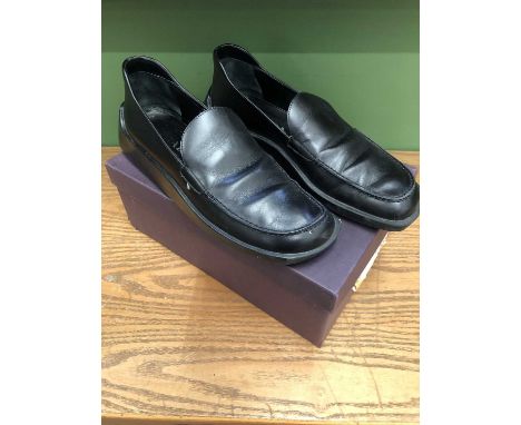 A pair of Prada black leather loafers size 40 1/2.                 