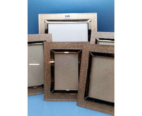 A set of Five decorative gold glitter Photograph frames with easel backs.