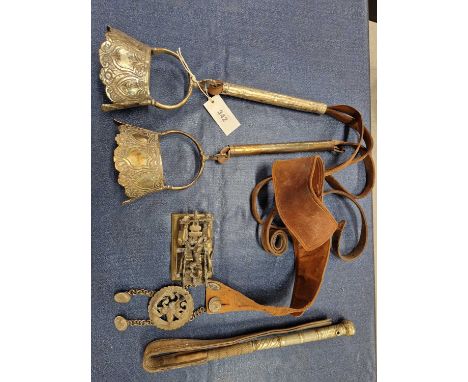 A pair of Argentinian silvered metal stirrups, a gaucho leather belt, a brass model bullock drawn cart together with a riding