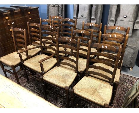 A set of twelve bespoke rush seat Lancashire ladder back dining chairs.
